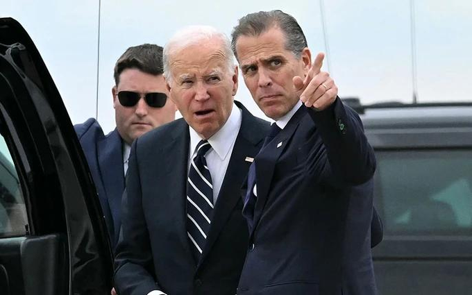 President Joe Biden, accompanied by Hunter Biden and a Secret Service agent, exits a vehicle, with Hunter pointing and speaking.