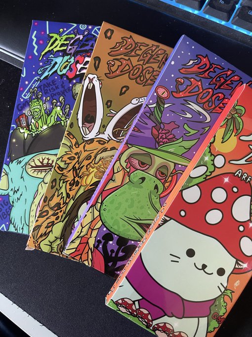 A collection of four colorful "Degen Dose" collectible cards featuring vibrant cartoon artwork of characters including a frog, a mushroom-hatted cat, and other quirky creatures, fanned out on a keyboard. The cards tie into the accompanying "Line em up and knock them down" post for @degendoses, showcasing the brand's playful, psychedelic art style.