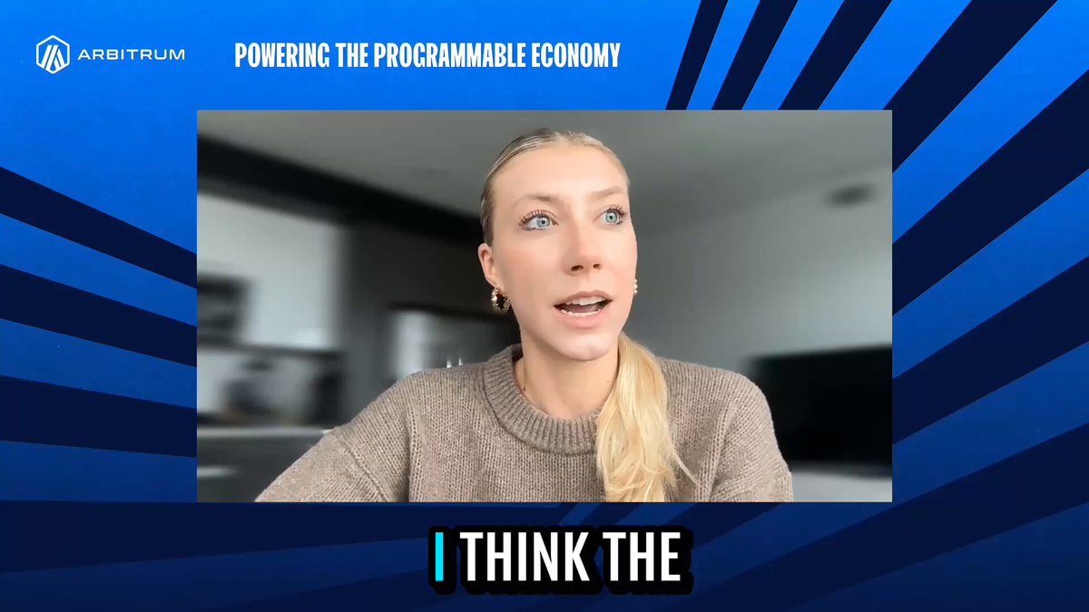 The image features a woman wearing a brown sweater who appears to be giving a speech or participating in an interview. The background of the image has blue stripes, which adds a vibrant touch to the scene. The caption below the image reads "I Think the future of commodities and equity markets is programmable." This statement suggests that the woman might be discussing the potential for technological advancements in the financial industry, such as the development of smart contracts or blockchain-based systems that can streamline trading processes and enhance transparency within the market.