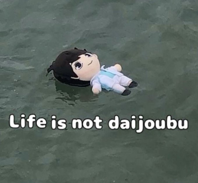 A plush doll floating on greenish water with the caption "Life is not daijoubu", referencing a common anime meme about feeling down.