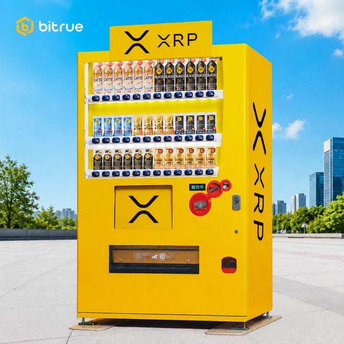 xtrp vending machine, yellow and black, displays "XRP" on its side with a red button for payment.
