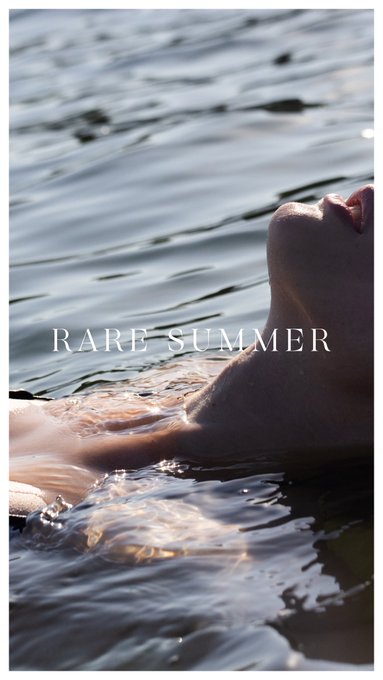 A close-up of a person's partially submerged face tilted toward the sky while floating in rippling water, overlaid with elegant text reading "RARE SUMMER," tying into the SuperRare NFT mint announcement beneath it.