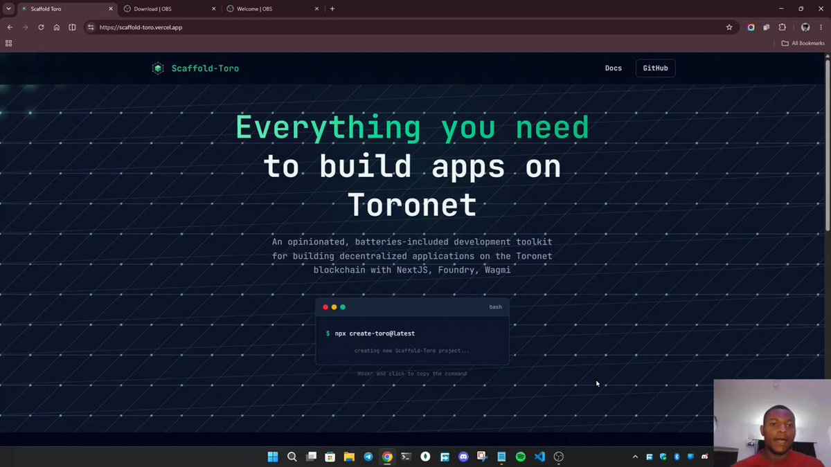 The image shows a computer screen with a man's face, likely a webcam feed of an online meeting or presentation. The background features a website called "Everything You Need To Build Apps On Toronet". The text on the screen reads "We just made building on Toronet a whole lot easier. Meet Scaffold-toro @Toroforge Drop a if you'r trying this out." This suggests that the image is related to a tutorial or guide about building apps using Toronet, and it features a man's face in front of the computer screen as an example.