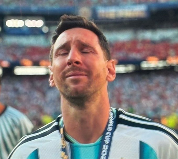 A tearful soccer player with closed eyes wears a medal reading "WORLD CUP 2022" around his neck, capturing the emotional aftermath of a hard-fought championship loss. The image humorously mirrors the post's sentiment about the disappointment of losing crypto on World Cup predictions, evoking that same crestfallen feeling of dashed hopes.