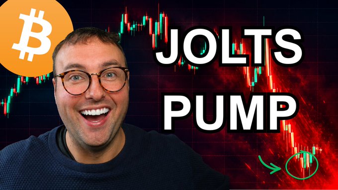 A YouTube thumbnail featuring a man with glasses smiling excitedly, a Bitcoin logo, and a red stock chart with the text 'JOLTS PUMP' and a green arrow pointing to a circled area.