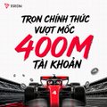 A promotional graphic features a red Formula 1 race car with bold Vietnamese text reading 'TRON CHINH THUC VUOT MOC 400M TAI KHOAN' against a white background.
