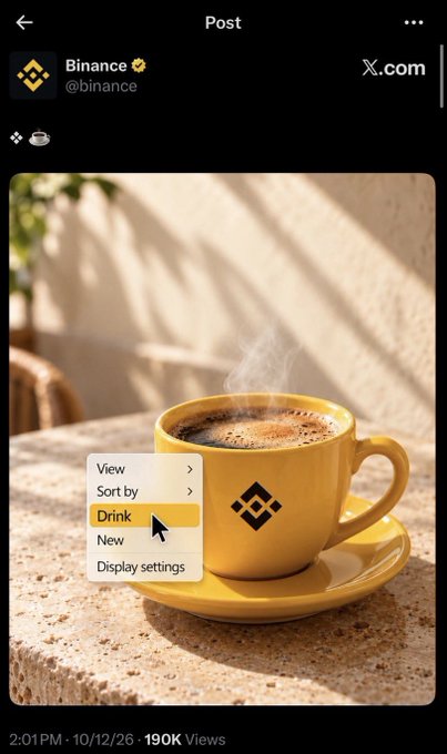 A Binance social media post featuring a steaming yellow coffee cup with the Binance logo, showing a humorous context menu with 'Drink' highlighted instead of typical file options.