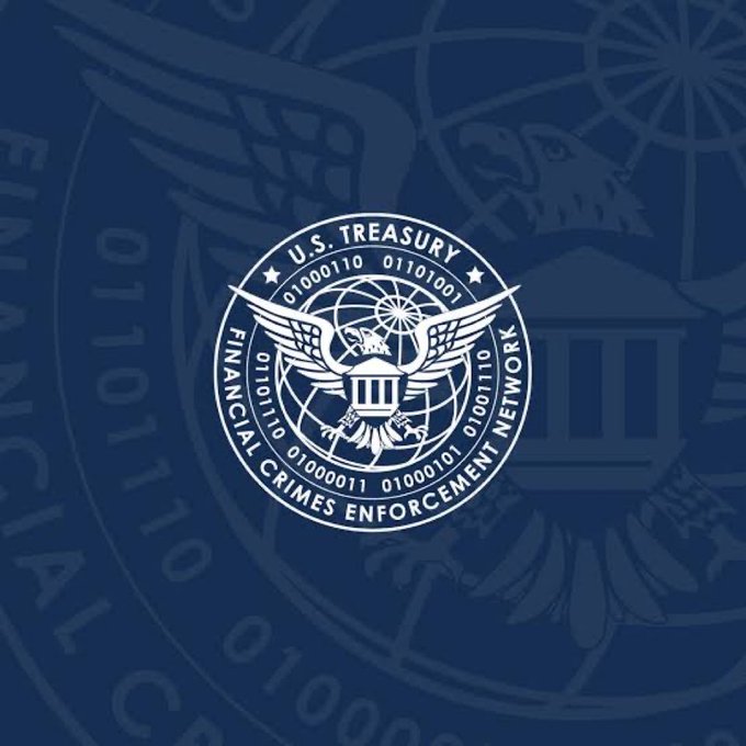 The U.S. Treasury Financial Crimes Enforcement Network seal is displayed in white on a dark blue background with binary code patterns.