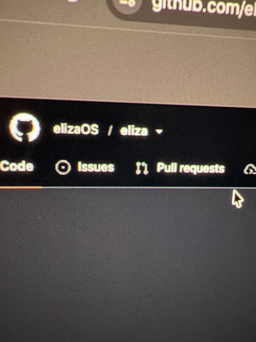 A close-up photo of a computer screen showing the GitHub repository page for 'elizaOS / eliza' with navigation tabs for Code, Issues, and Pull requests.