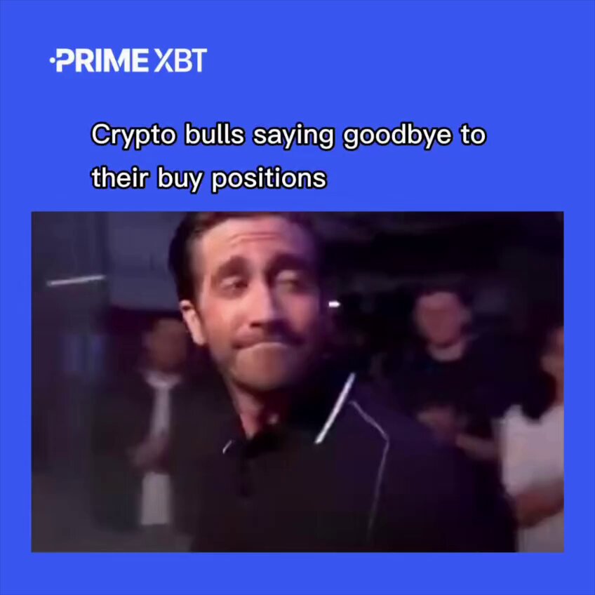 The image shows a man wearing a black shirt with white stripes, looking at something off-camera while standing against a blue background. There are several other people present in the scene as well. The caption of the image reads "Bull trap or buying opportunity?". This suggests that there might be an investment opportunity related to cryptocurrency, and the man is considering whether it's worth pursuing.