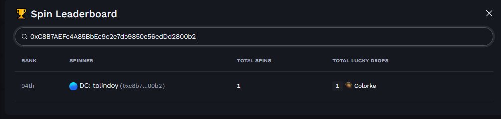 A 'Spin Leaderboard' interface showing rank 94th for spinner DC: to lindoy (0xc8b7...00b2) with 1 total spin and 1 Coloroke lucky drop, with the full address 0xC8B7AEFc4A85BbEc9c2e7db9850c56edDd2800b2 in the search bar.