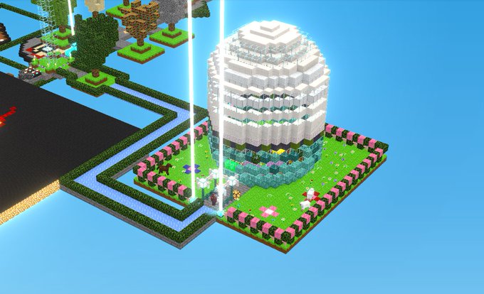 Voxel-style 3D build of a large white domed structure surrounded by a pink flower garden and water features.