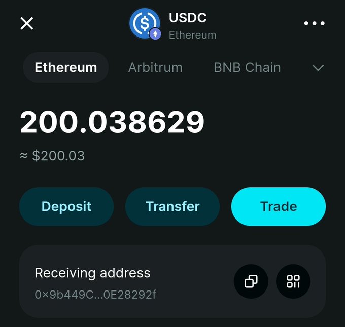 A cryptocurrency wallet interface displaying a USDC balance of 200.038629 (approximately $200.03) on the Ethereum network, with options to Deposit, Transfer, or Trade, and a receiving address shown as 0x9b449C...0E28292f.