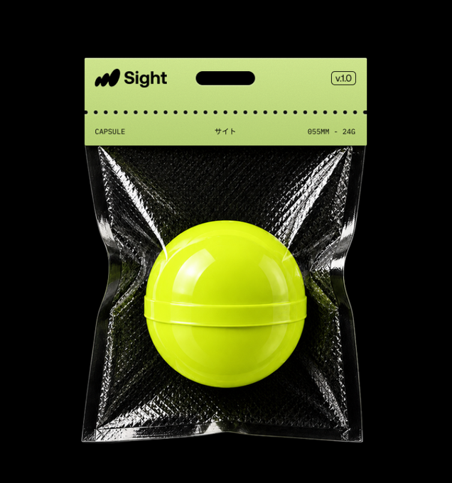 A neon green spherical 'CAPSULE' object labeled 'Sight v.1.0' and '055MM - 24G' is packaged in clear plastic with a green cardboard header.