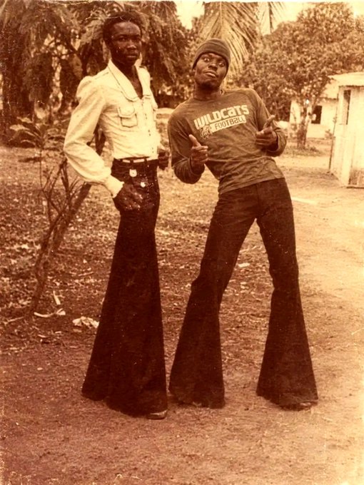 Image 3: A vintage sepia-toned photograph of two men standing outdoors, both wearing flared pants, with one wearing a "WILDCATS FOOTBALL" sweatshirt and beanie, and the other in a light-colored button-up shirt.
