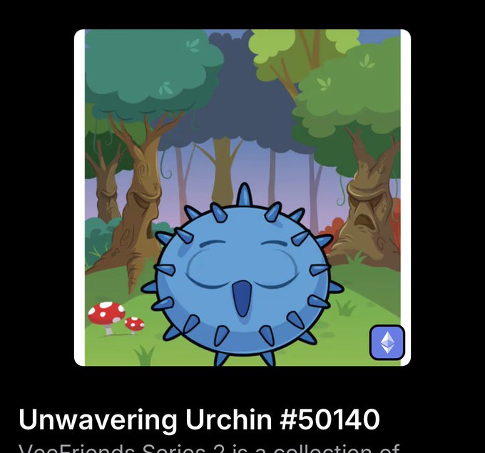 An NFT titled 'Unwavering Urchin #50140' from the 'VeeFriends Series 2' shows a smiling, spiky blue cartoon creature standing in a green forest with a red mushroom, displayed on a black background.