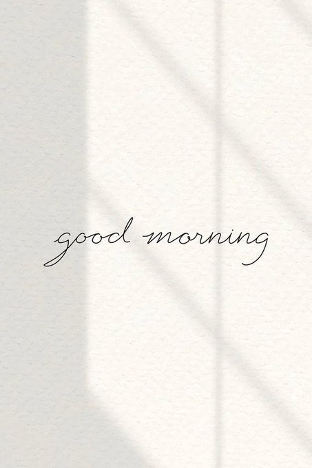 Minimalist aesthetic image with the cursive text 'good morning' on a textured beige background with subtle shadows.