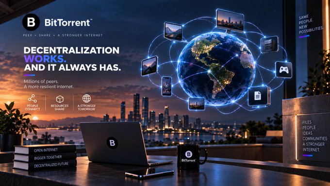 A promotional graphic for BitTorrent featuring the slogan 'DECENTRALIZATION WORKS. AND IT ALWAYS HAS.', showing a glowing Earth connected to various devices above a desk with a BitTorrent mug and notebook.