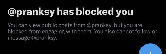 A black notification screen with white text states '@pranksy has blocked you,' explaining that you can view public posts but cannot engage, follow, or message the user.