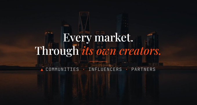 A dark, atmospheric cityscape at night with a prominent skyscraper featuring the text "Every market. Through its own creators." along with the categories "COMMUNITIES • INFLUENCERS • PARTNERS" displayed below.

The image appears unrelated to the post's content about staking rewards and compounding, as it instead serves as a generic branding or marketing graphic emphasizing community-driven market creation.