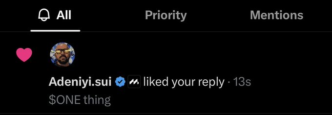 A screenshot of a social media notification showing that Adeniyi.sui (verified, with a manji 卍 symbol) liked a reply containing the text "$ONE thing", with a pink heart icon visible.