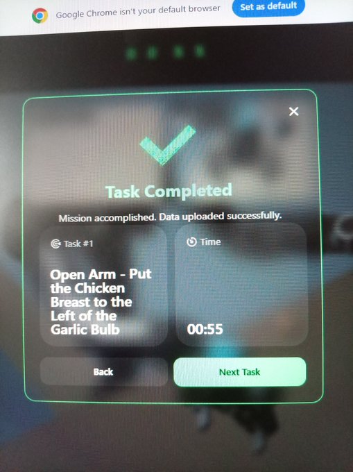 A 'Task Completed' confirmation screen for 'Task #1: Open Arm - Put the Chicken Breast to the Left of the Garlic Bulb,' completed in 55 seconds.