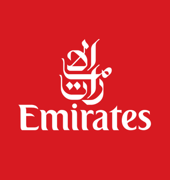 The image displays the Emirates airline logo, featuring stylized Arabic calligraphy above the word "Emirates" in white text on a red background, which relates to the announcement that Emirates now accepts cryptocurrency payments from UAE residents for flight bookings.