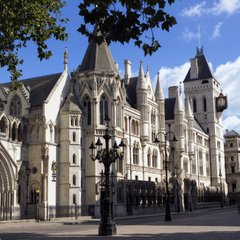 The Royal Courts of Justice in London, a Gothic Revival building housing the High Court, stands prominently with its grand stone facade, turrets, and pointed spires. This iconic UK legal landmark ties directly to the post, as it is where the High Court judge recently ruled that Chinese law applies to claims over 61,000 seized Bitcoin worth around $5 billion.