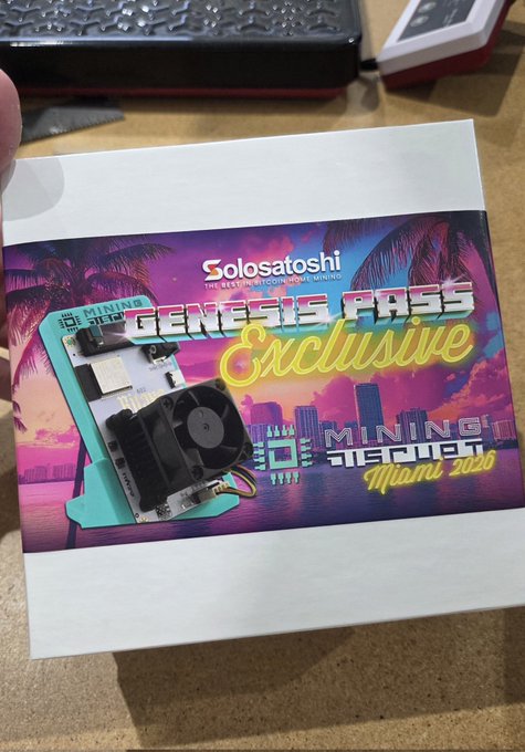 A hand holds a promotional card featuring a teal Bitaxe miner with "GENESIS PASS Exclusive" and "Solosatoshi" branding, alongside a Miami 2020 synthwave cityscape, commemorating the free Bitaxe giveaway for Mining Disrupt Miami Genesis Pass holders.