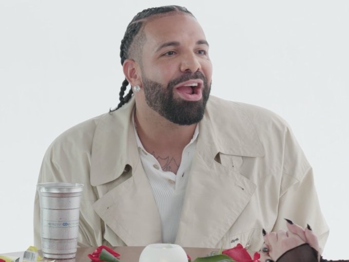 The image shows a man with braided hair and a beard, wearing a beige trench coat, laughing and looking to the side, likely capturing an enthusiastic reaction to the post's playful "bark" joke about holding $ANSEM crypto. The caption "Ansem: 'Bark if you hold $ANSEM on Bullpen' Me:" humorously implies he couldn't contain his excitement.