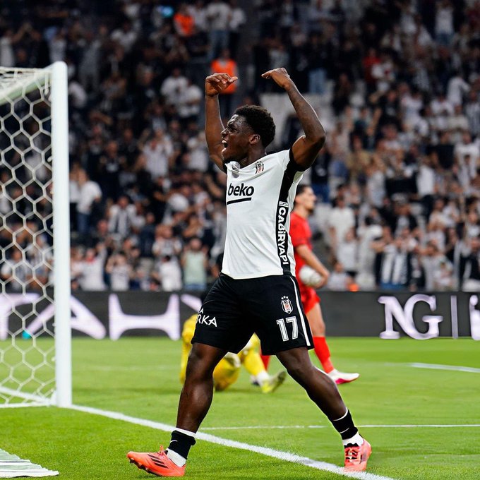 A Beşiktaş player wearing jersey #17 celebrates a goal by raising both arms in triumph near the goalpost, with the "beko" sponsor logo prominently displayed on his white jersey. The caption "It starts in the first 11" suggests this player made an impact shortly after being substituted into the match, highlighting a key contribution from the bench.