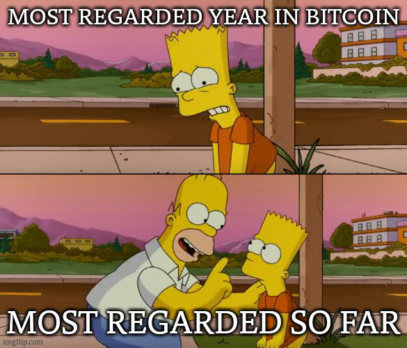 The image is a two-panel "Bart Simpson shaking Homer" meme. The top panel shows Bart looking confused with the caption "MOST REGARDED YEAR IN BITCOIN," and the bottom panel shows Homer pointing at Bart with the caption "MOST REGARDED SO FAR," humorously illustrating the original post's claim that the current year has been an exceptionally significant and "regarded" (slang for crazy/notable) one for Bitcoin.