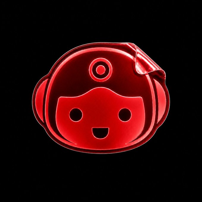 A glossy, red 3D-rendered robot or monkey-like face icon with large round eyes and an open smiling mouth, displayed against a black background with a peeled corner effect.