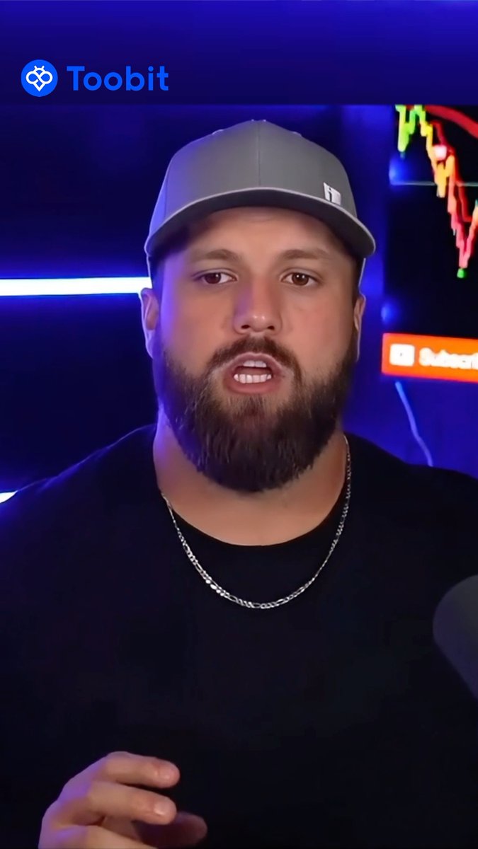 Screenshot of a man with a beard wearing a grey cap and black shirt speaking in what appears to be a livestream, with the Toobit exchange logo visible in the top left corner.