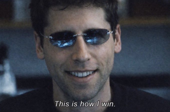 The image shows a smiling man wearing reflective sunglasses, with the subtitle "This is how I win." The post humorously compares this confident, victorious line to OpenAI's last-minute "Sol Terra Luna rollout" announcement, suggesting the company's sudden and triumphant move mirrors the character's smug winning moment.
