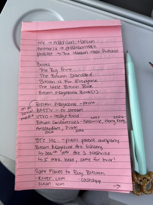 A handwritten pink notepad listing resources for Madison Hanson including her Twitter handle @HansonTech, books like 'The Bitcoin Standard' and 'Bitcoin is For Everyone', Bitcoin conferences, and safe places to buy Bitcoin like river.com and swan.com.