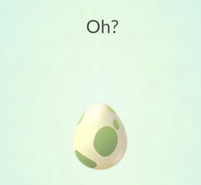 A cute 3D-rendered egg character with green spots on a light green background with the text 'Oh?' displayed above it.