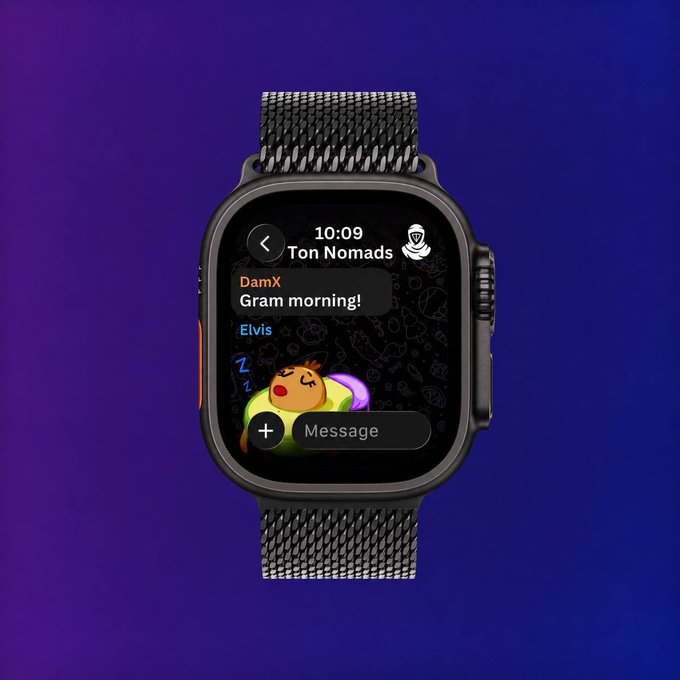 The image shows a smartwatch with a message displayed on its screen, which reads "GM". This message appears to be from someone named Tom Nomads who has sent the message at 10:09 AM. The watch's design features a black band that contrasts with the blue background of the image.