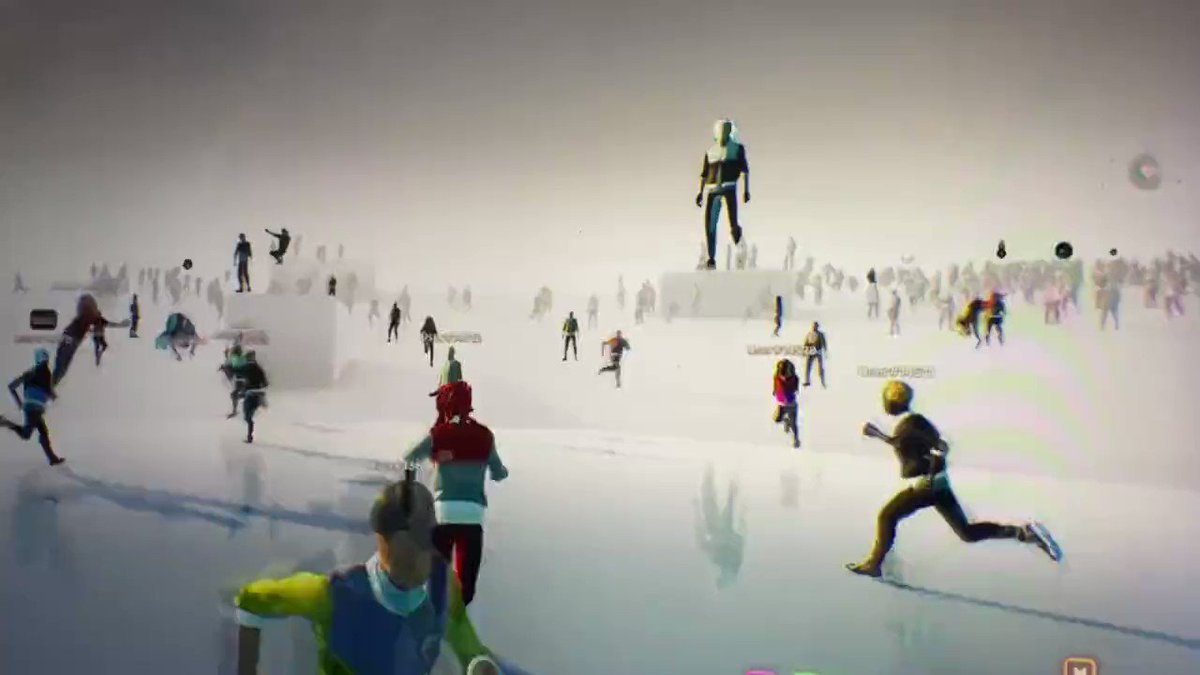 The image shows a group of people running across a frozen surface, possibly ice skating or playing hockey. There are at least 13 visible individuals scattered throughout the scene, with some closer together while others maintain more distance from each other. The overall atmosphere appears to be energetic and lively as they engage in this winter activity.