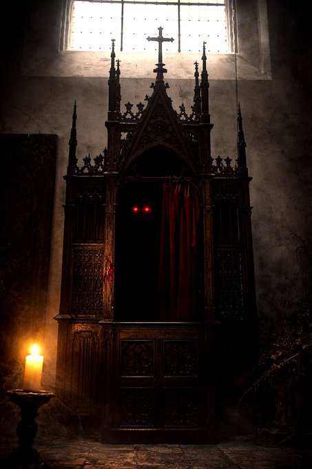 A Gothic confessional booth stands in a dim, decaying church interior, illuminated by a single candle, with two glowing red eyes peering from behind the red curtain inside the dark enclosure.