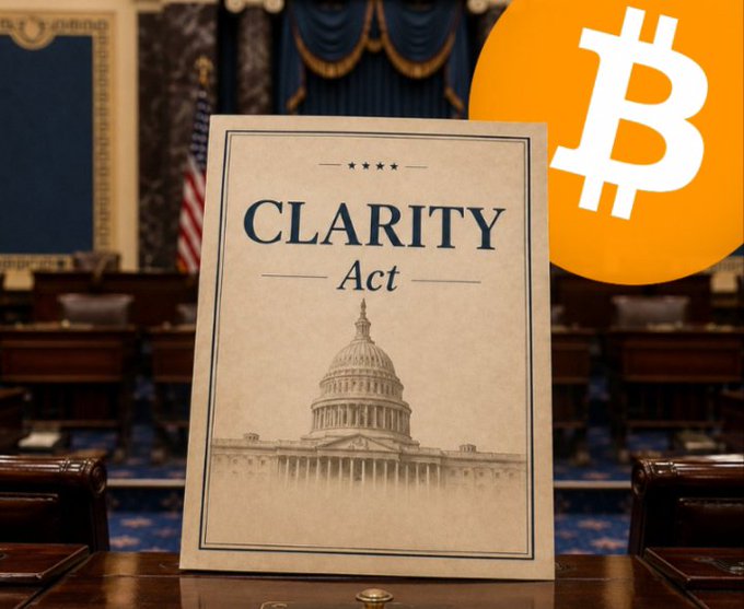 A document labeled "CLARITY Act" featuring an illustration of the U.S. Capitol sits on a desk in what appears to be the Senate chamber, with an orange Bitcoin logo overlaid in the upper right corner—visually reinforcing the post's urgent call for the Senate to pass crypto legislation before the next opportunity potentially slips to 2030.