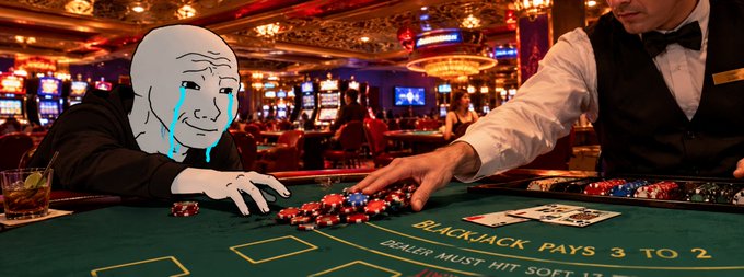 A meme-style image showing the 'Wojak' crying cartoon character in a hoodie sitting at a blackjack table in a casino, where a dealer is pushing a large pile of red and blue poker chips toward them.
