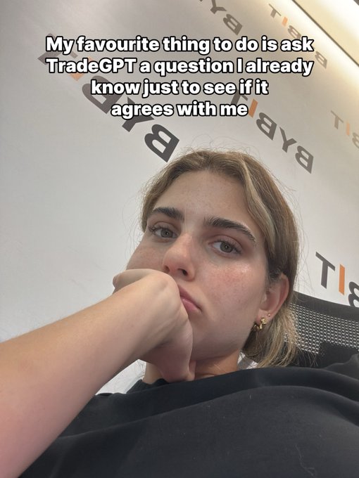 A young woman rests her chin on her hand with a contemplative expression, with overlaid text reading "My favourite thing to do is ask TradeGPT a question I already know just to see if it agrees with me." The image humorously captures the relatable tendency of seeking AI validation for opinions one already holds, tying into the "Me TradeGPT..." caption's lighthearted take on human-AI interaction.