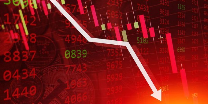A red financial chart showing a downward-trending white arrow over candlestick graphics and stock ticker numbers, indicating a market decline.