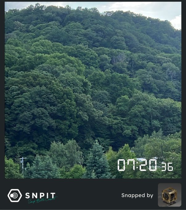 A lush, densely forested mountainside captured at 07:20:36 in the morning, displayed with a G-SHOCK camera overlay showing the SNPIT Snap Battle Coin branding at the bottom, aligning with the post about using the G-SHOCK camera with a timestamped +09 hour offset for JST.