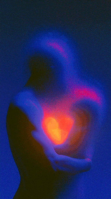 The image features a couple embracing each other, with one person holding an orange heart that appears to be glowing red. The background of the photo is dark blue, which contrasts with the bright colors of the heart and the couple's embrace. The caption "Self Love 1/1 on TransientLabs Reserve 0.02 ETH" suggests that this image might have been taken by someone who has recently posted it online or in a social media platform.