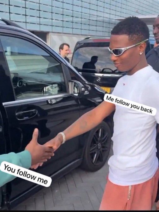 Two people shaking hands outside near a black car, with one person wearing sunglasses and a white shirt; text overlays read "Me follow you back" near the man in the shirt and "You follow me" near the outstretched hand, visually representing a mutual social media follow exchange described in the post.