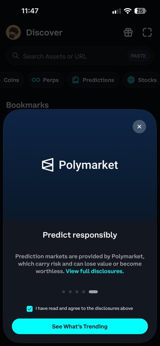 Phantom wallet app showing a Polymarket bookmark with a 'Predict responsibly' disclosure about prediction markets and a 'See What's Trending' button.
