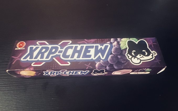 A purple package of XRP Chewing Gum featuring a cartoon cat mascot and grape imagery.