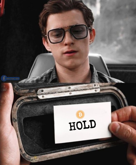 The image shows a man wearing glasses sitting in a vehicle, paired with a bottom panel of someone holding open a rugged case containing a card labeled "HOLD" with a Bitcoin (₿) logo — humorously answering the post's "Give me a sign" request with crypto advice to hold Bitcoin.